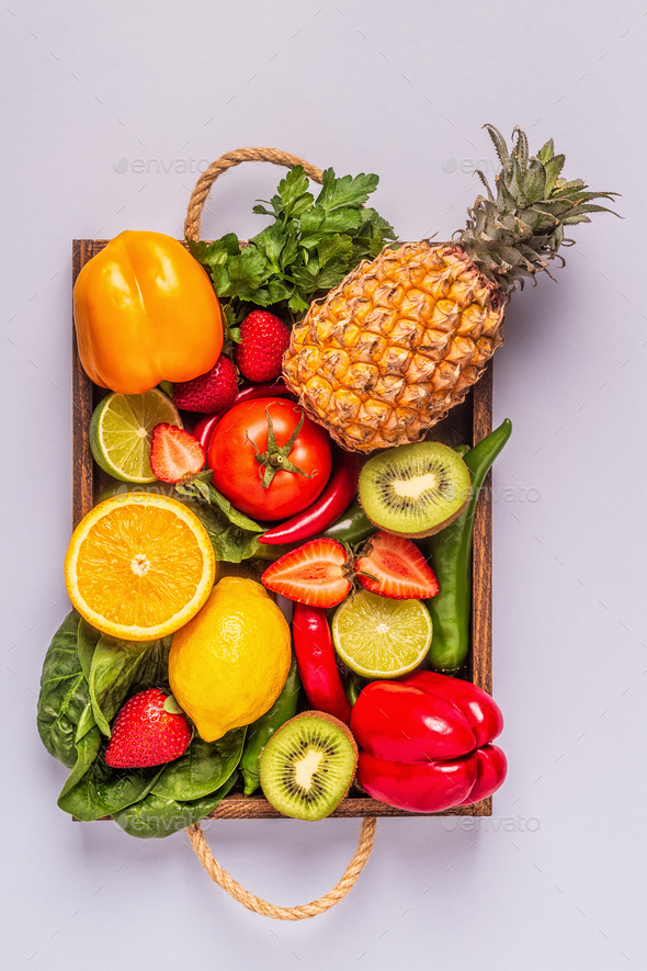 Fruits and vegetables rich in vitamin C in box. Stock Photo by tatiana